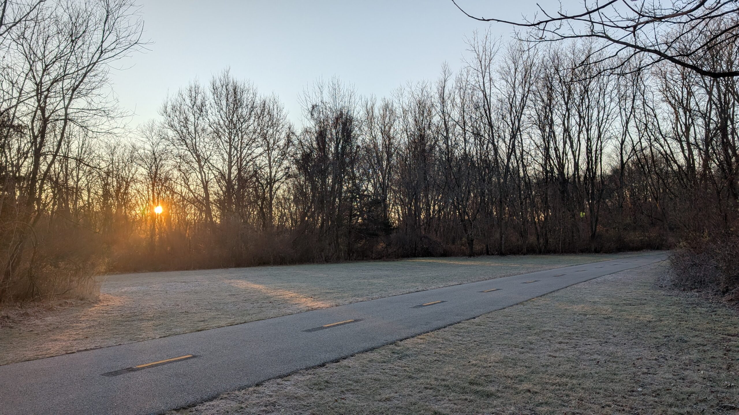 A photo of the Blackstone River Bike Path covered in morning frost